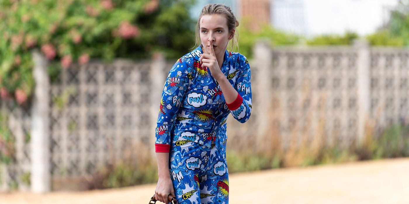 Villanelle from Killing Eve, wearing pyjamas and putting her finger to her mouth to quiet someone.