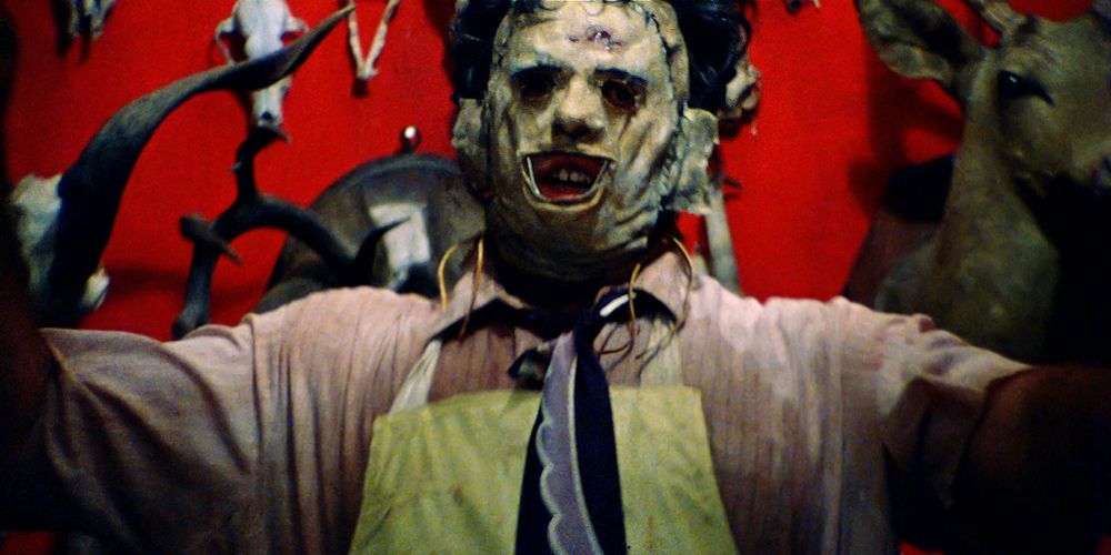 Leatherface stands in doorway in The Texas Chainsaw Massacre