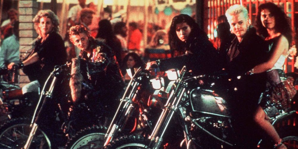 David and his vampire gang ride motorcycles on boardwalk in The Lost Boys