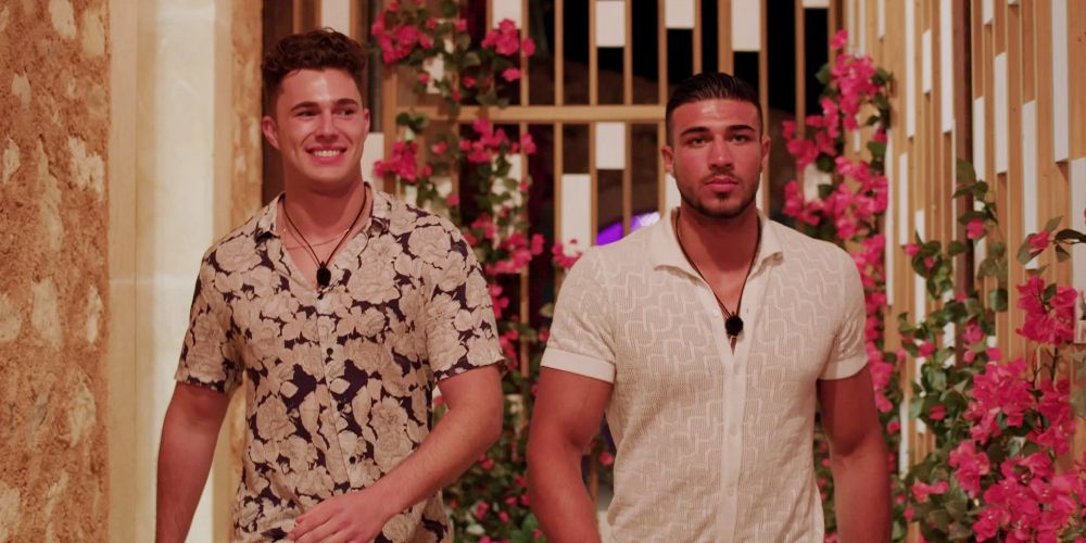 Love Island stars Curtis and Tommy walks side by side