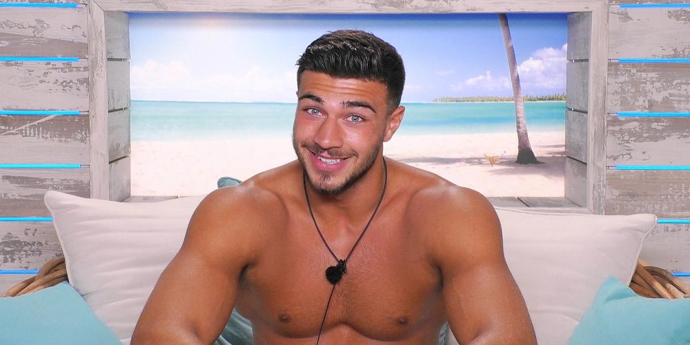 Tommy Fury smiles on the Love Island confessional couch