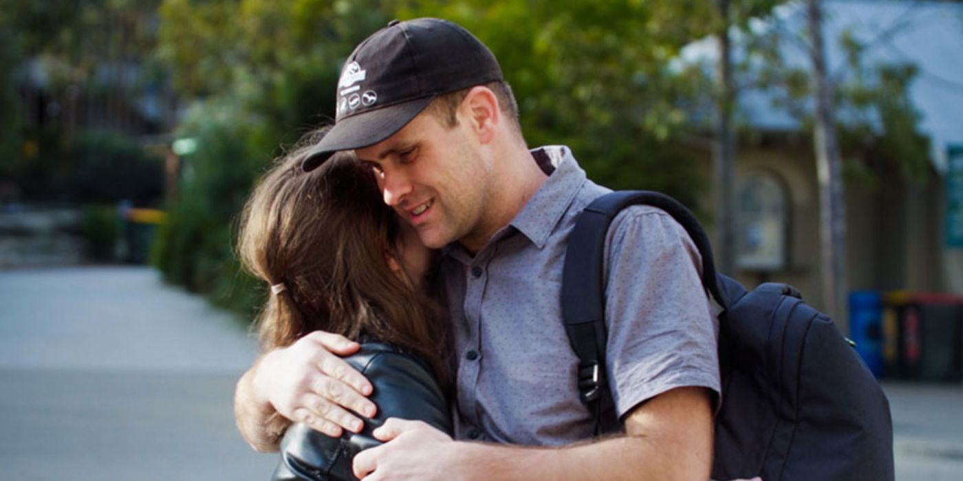 Mark and Chloe from Love on the Spectrum in an embrace.