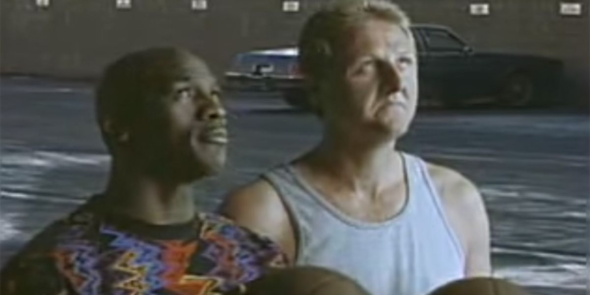 Michael Jordan &amp; Larry Bird look up in a basketball court in a McDonald's commercial.