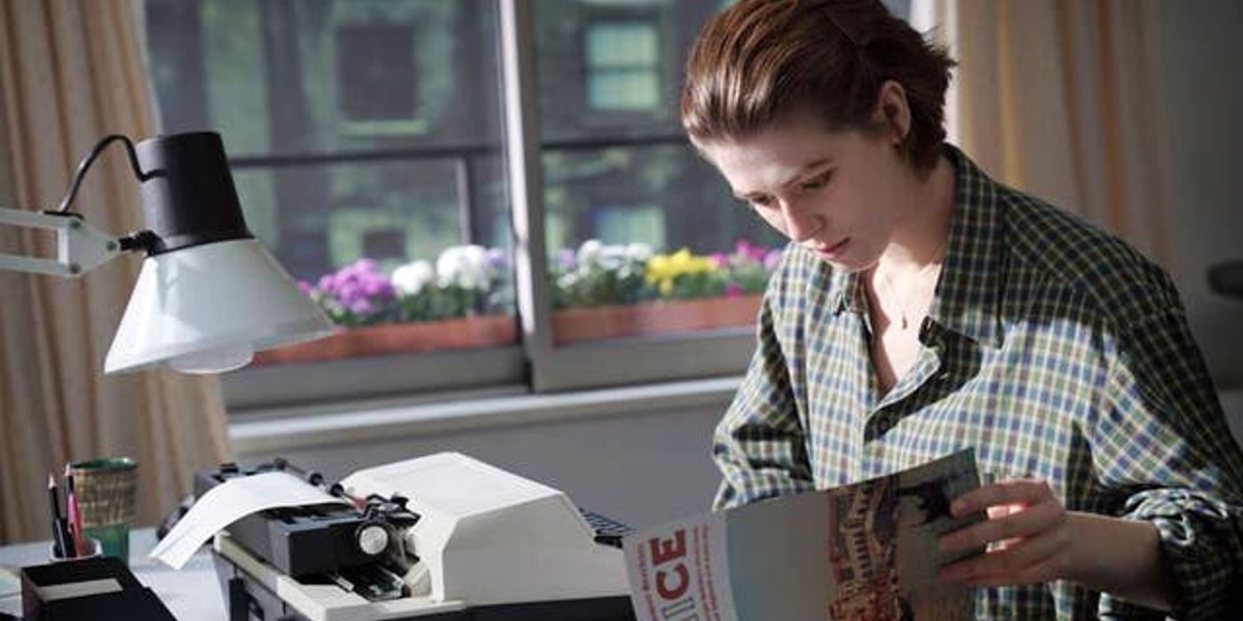 Julie sits at a typewriter in The Souvenir Part II