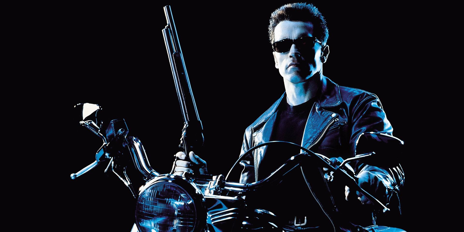 The Terminator sits on his motorcycle holding a shotgun.
