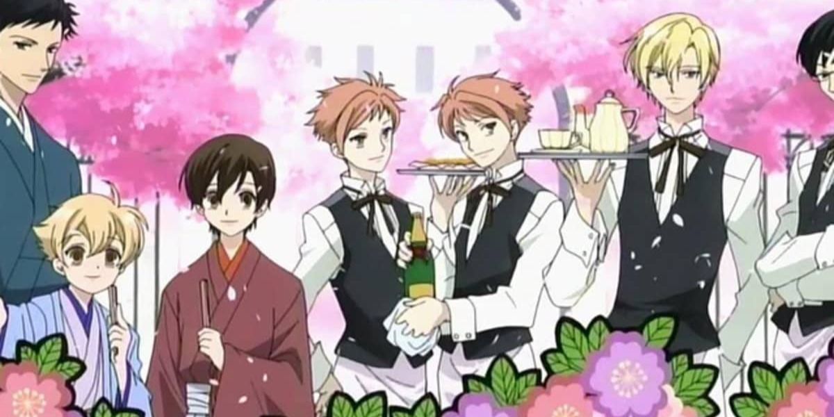 The Host Club from Ouran High School Host Club dressed as waiters smiling at the camera.