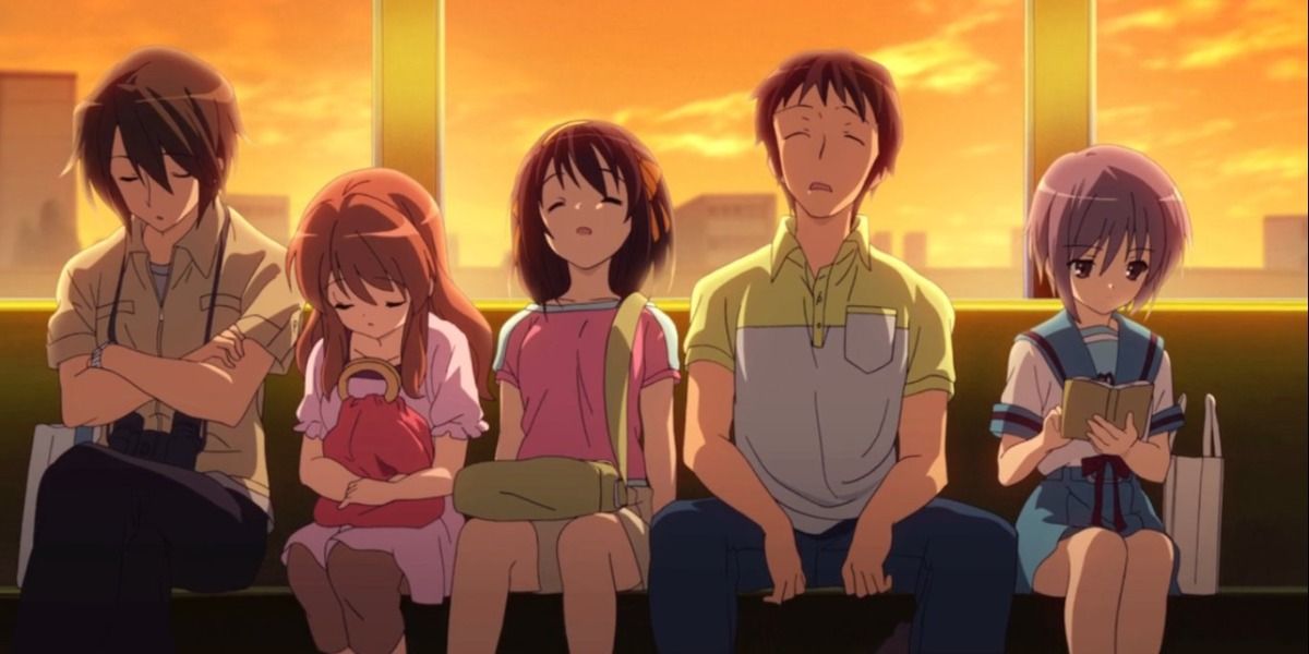 the SOS Brigade sat together on a train at sunset in The Melancholy Of Haruhi Suzumiya