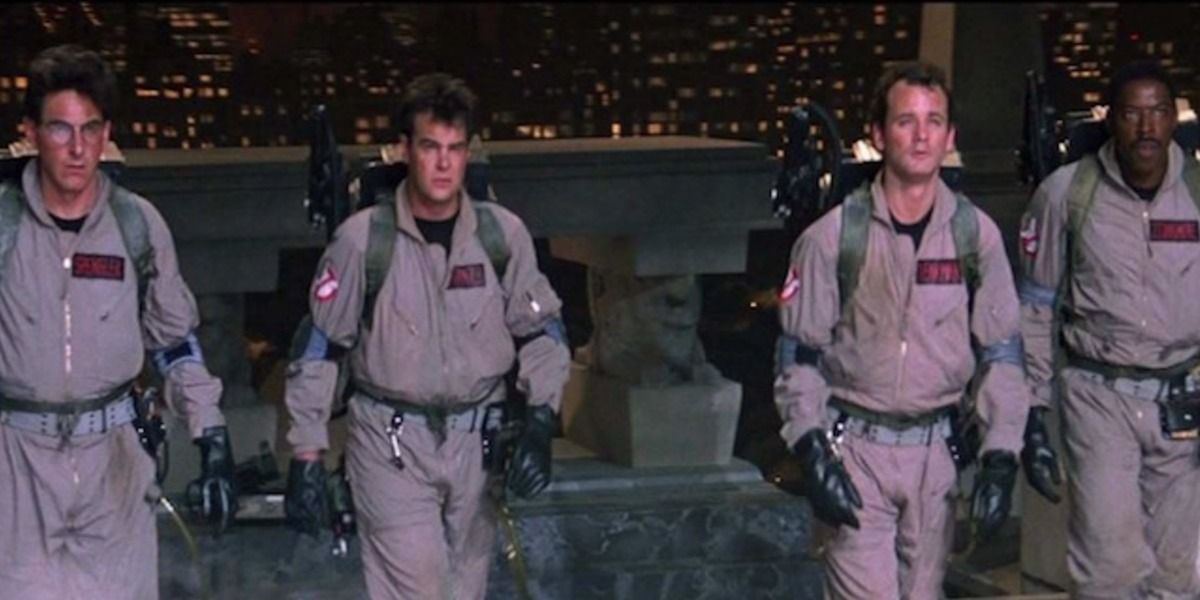 the four original Ghostbusters walking up to the gateway