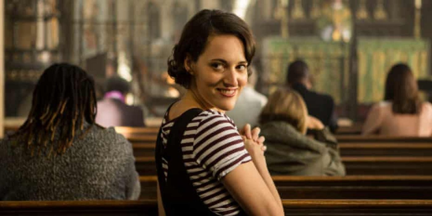 the main character of Fleabag sat in church grinning over her shoulder