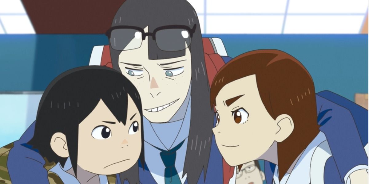 the three main characters of Keep Your Hands Off Eizouken huddled together, Kanamori is smiling