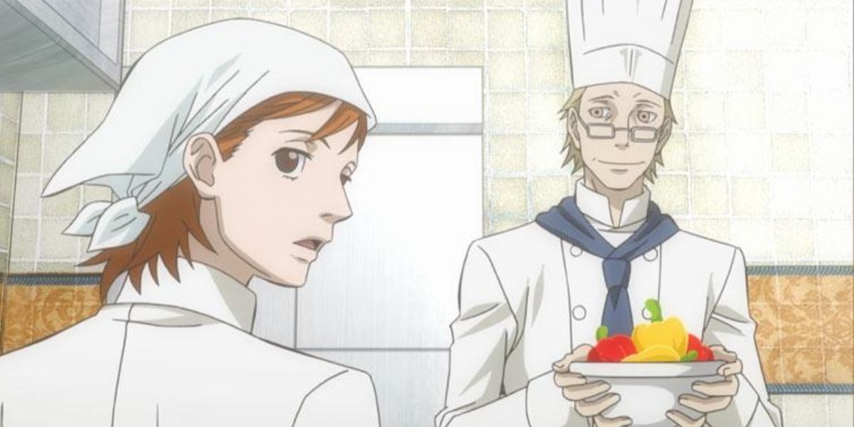 two chefs from Ristorante Paradiso, one of them looks suspicious, the other is smiling and carrying a bowl of ingredients