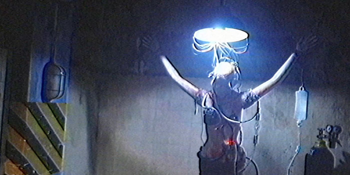 A woman with wires coming out of her in VHS 94