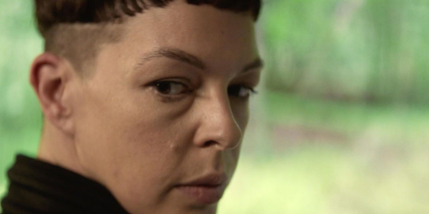 Jadis from The Walking Dead in a promo from The Walking Dead: World Beyond, looking over her shoulder.