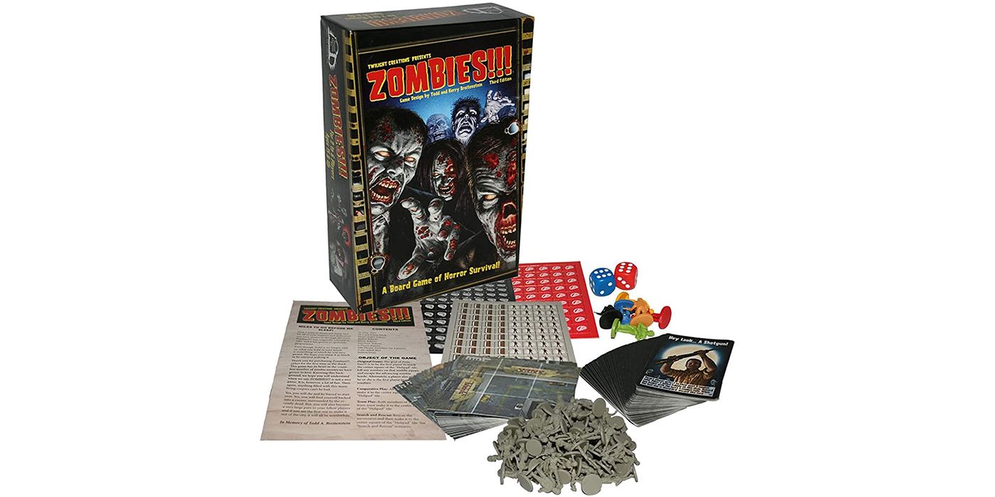 The box of the Zombies !!! board game with the pieces in front of it.