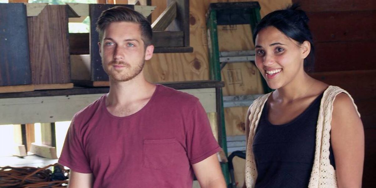 Amy and Danny from TLC's 90 Day Fiance series standing together in a barn