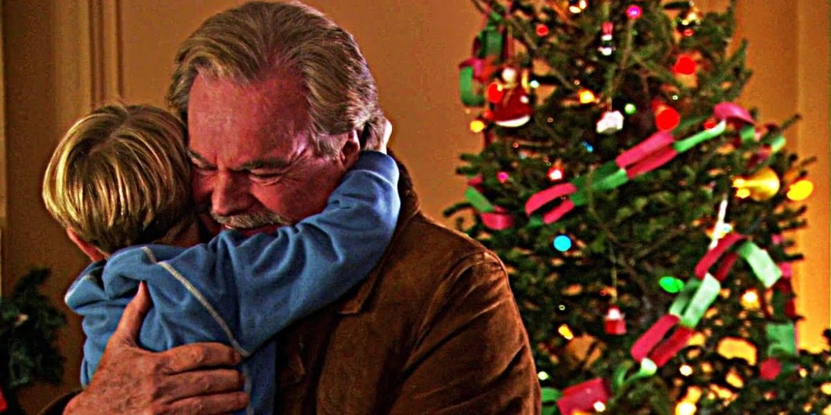 An old man hugs a blond male child in A Dennis The Menace Christmas