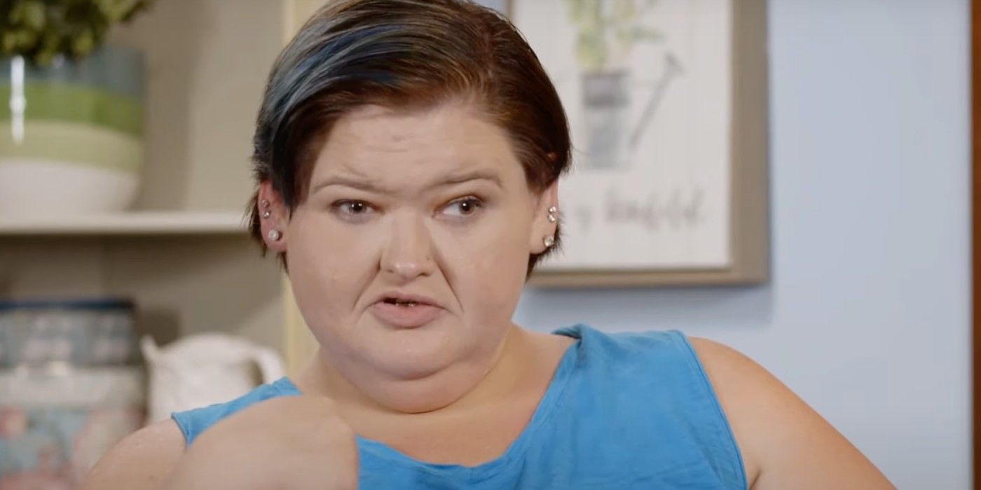 Amy Slaton From 1000-lb Sisters wearing blue shirt in kitchen