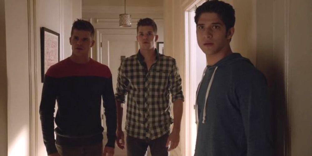 An image of Aiden, Ethan and Scott inspecting a hallway in Teen Wolf