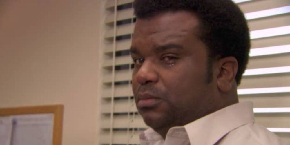 An image of Darryl crying in The Office