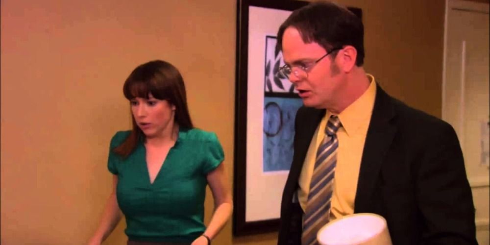 An image of Dwight and Erin looking scared in The Office