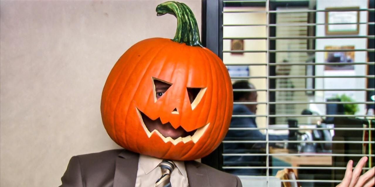 An image of Dwight sitting with a pumpkin on his head on The Office