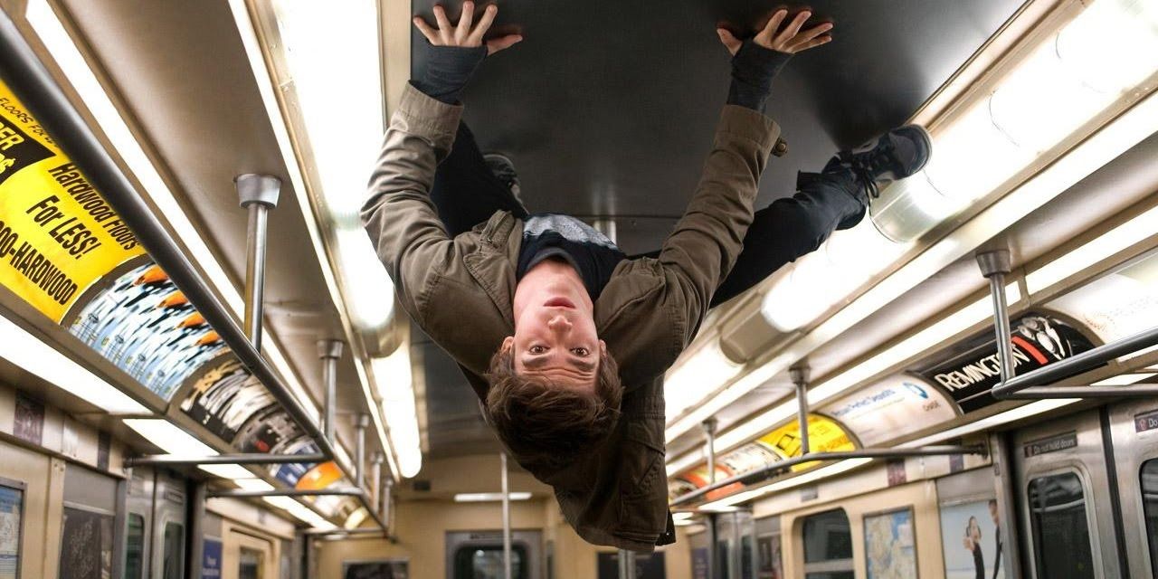 An image of Peter Parker crawling on the ceiling on a subway in Amazing Spider-Man