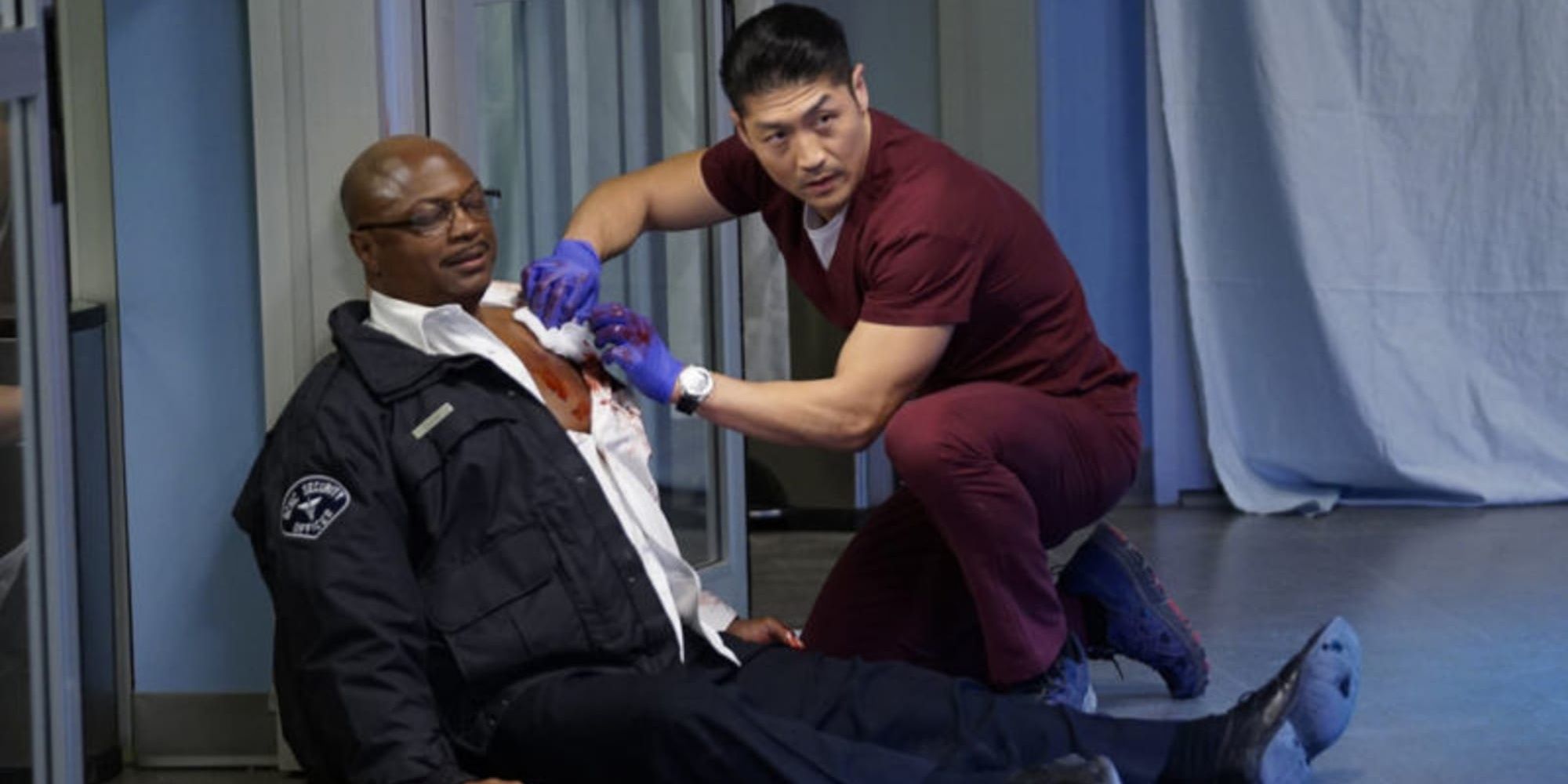 A security guard receives treatment after trying to stop a gunman in Chicago Med