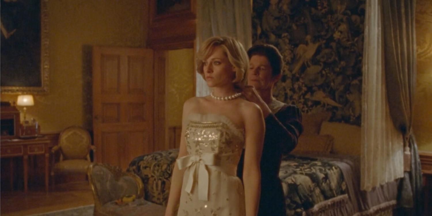 Angela dressing Diana in an opulent bedroom in Spencer
