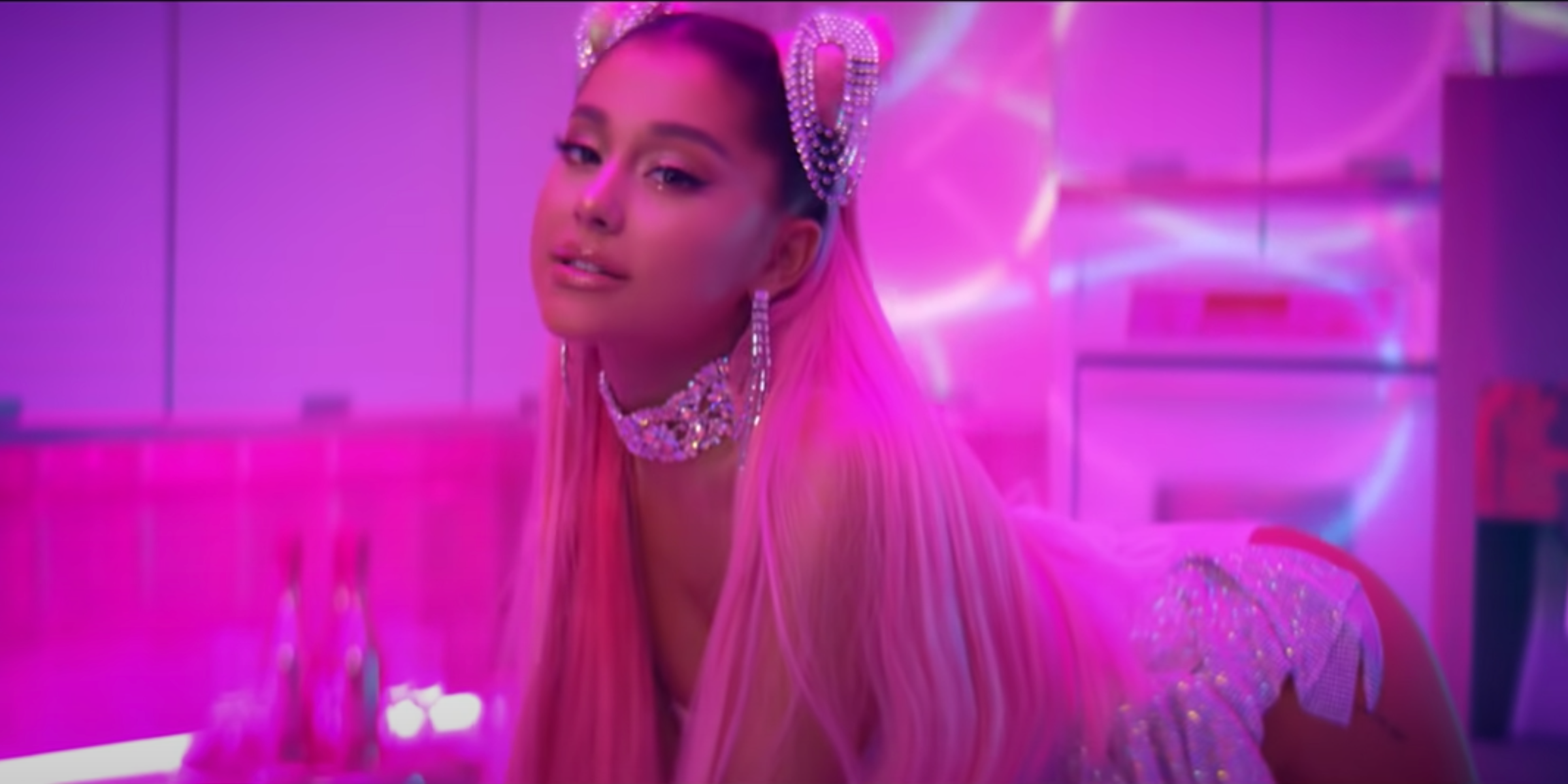 An image of Ariana Grande gazing at the viewer in her music video for 7 Rings