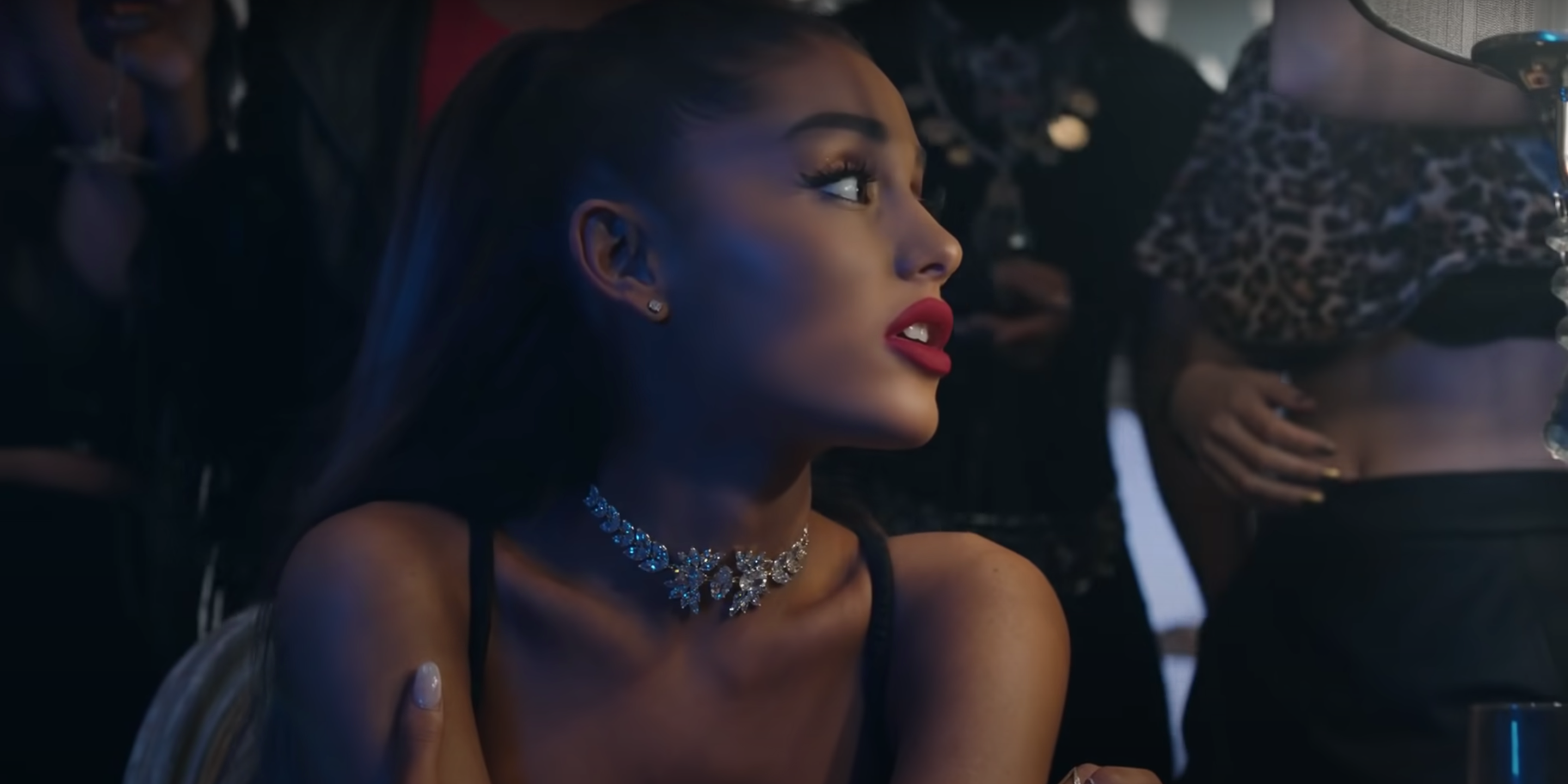 An image of Ariana Grande glancing off to the side in the music video for Into You.