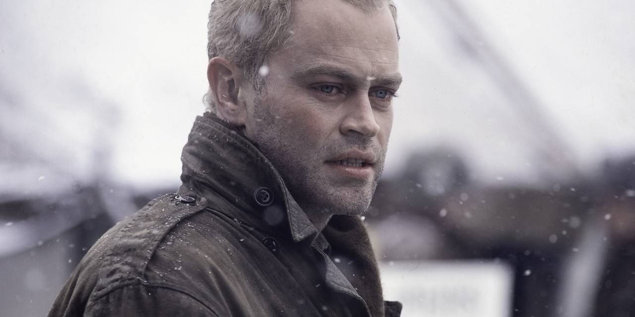 Neal McDonough, as Lynn &quot;Buck&quot; Compton, stands in the snow in Band of Brothers