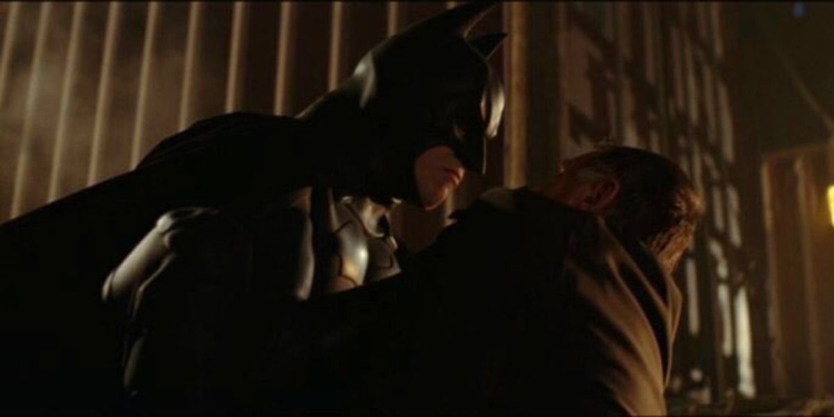 Batman apprehending Carmine Falcone at the docks in Batman Begins