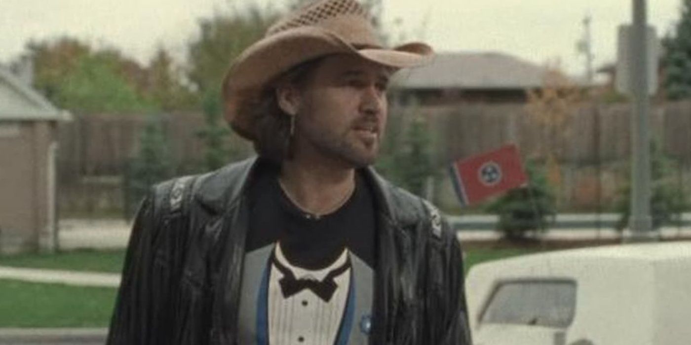 Billy Ray Cyrus on Degrassi in a cowboy hat and tuxedo tshirt.