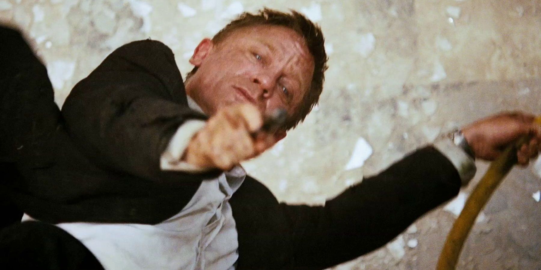 Bond hangs from scaffolding in the opening scene of Quantum of Solace