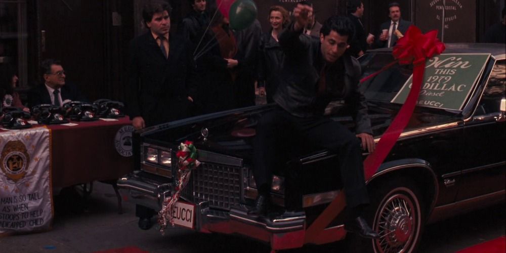 Joey Zasa's henchmen pose with the Cadillac Eldorado in The Godfather
