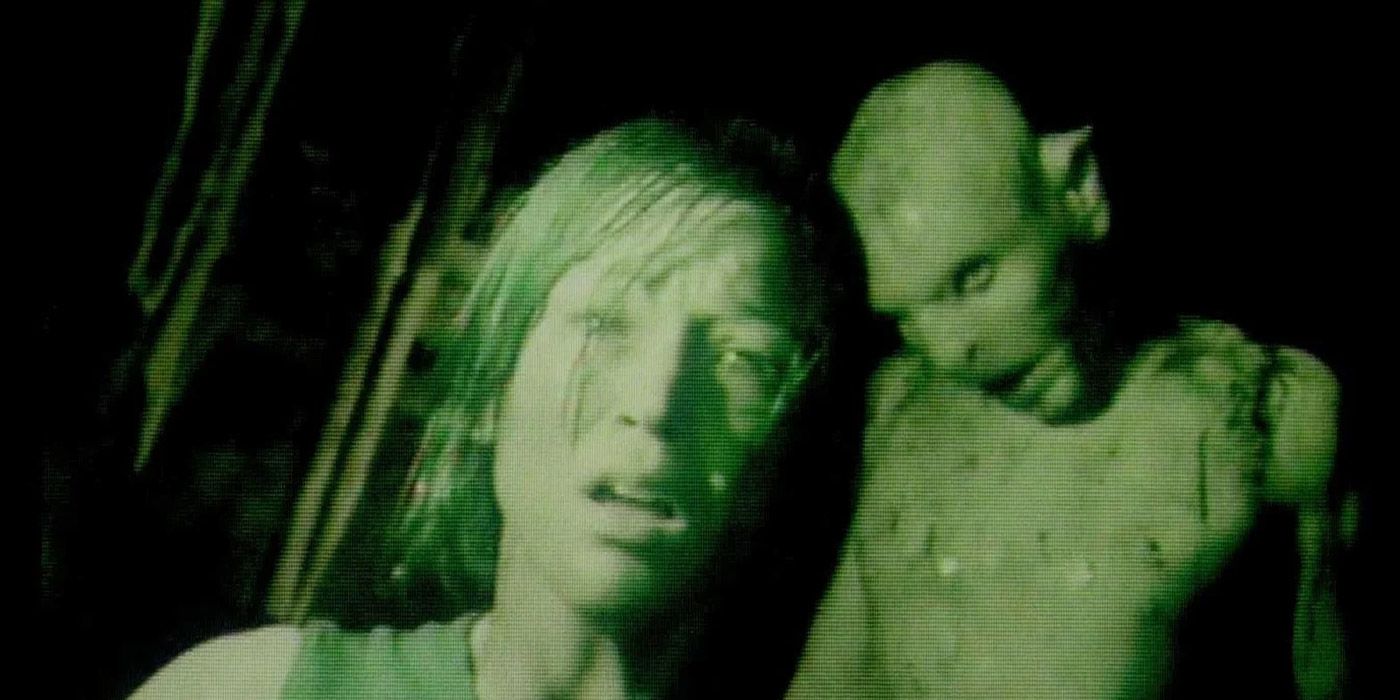 Uma câmera de visão noturna mostrando uma garota e um ghoul em The Descent.