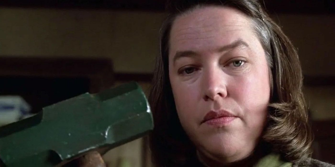 Annie Wilkes holding a sledgehammer in Misery.