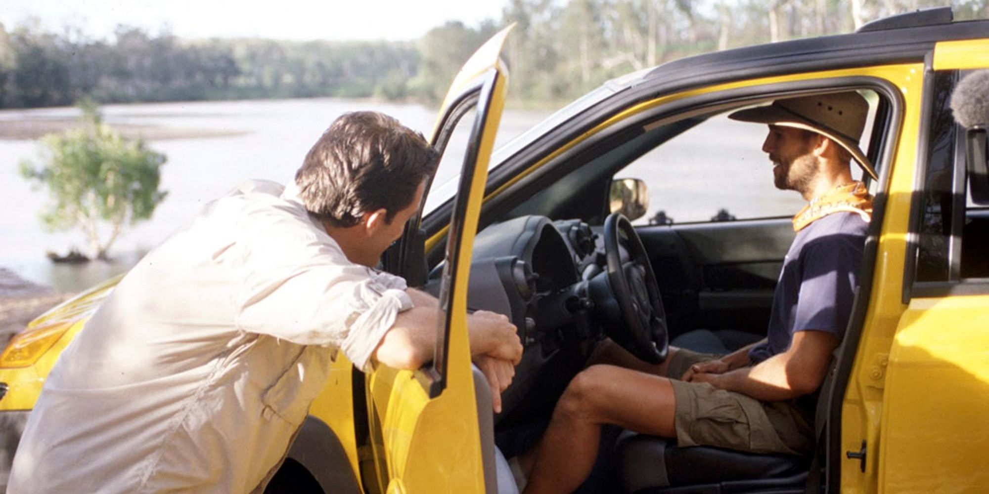 Colby sitting in a yellow car in Survivor
