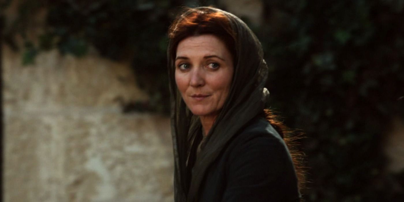 Catelyn Stark with a warm expression and wearing a headdress in Game of Thrones
