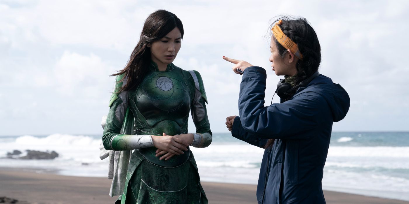 Chloe Zhao and Gemma Chan on a beach in a behind-the-scenes shot on the Eternals
