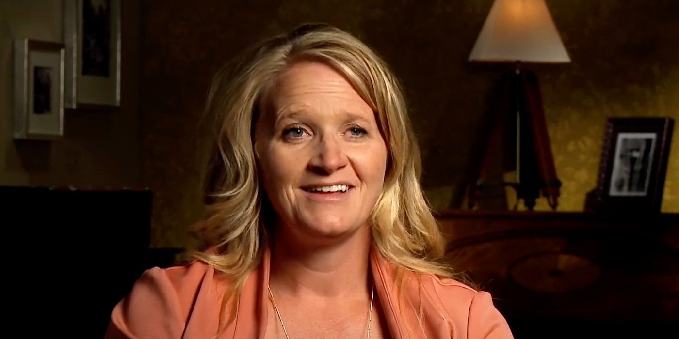 Sister Wives' Christine Brown smiling dressed in orange