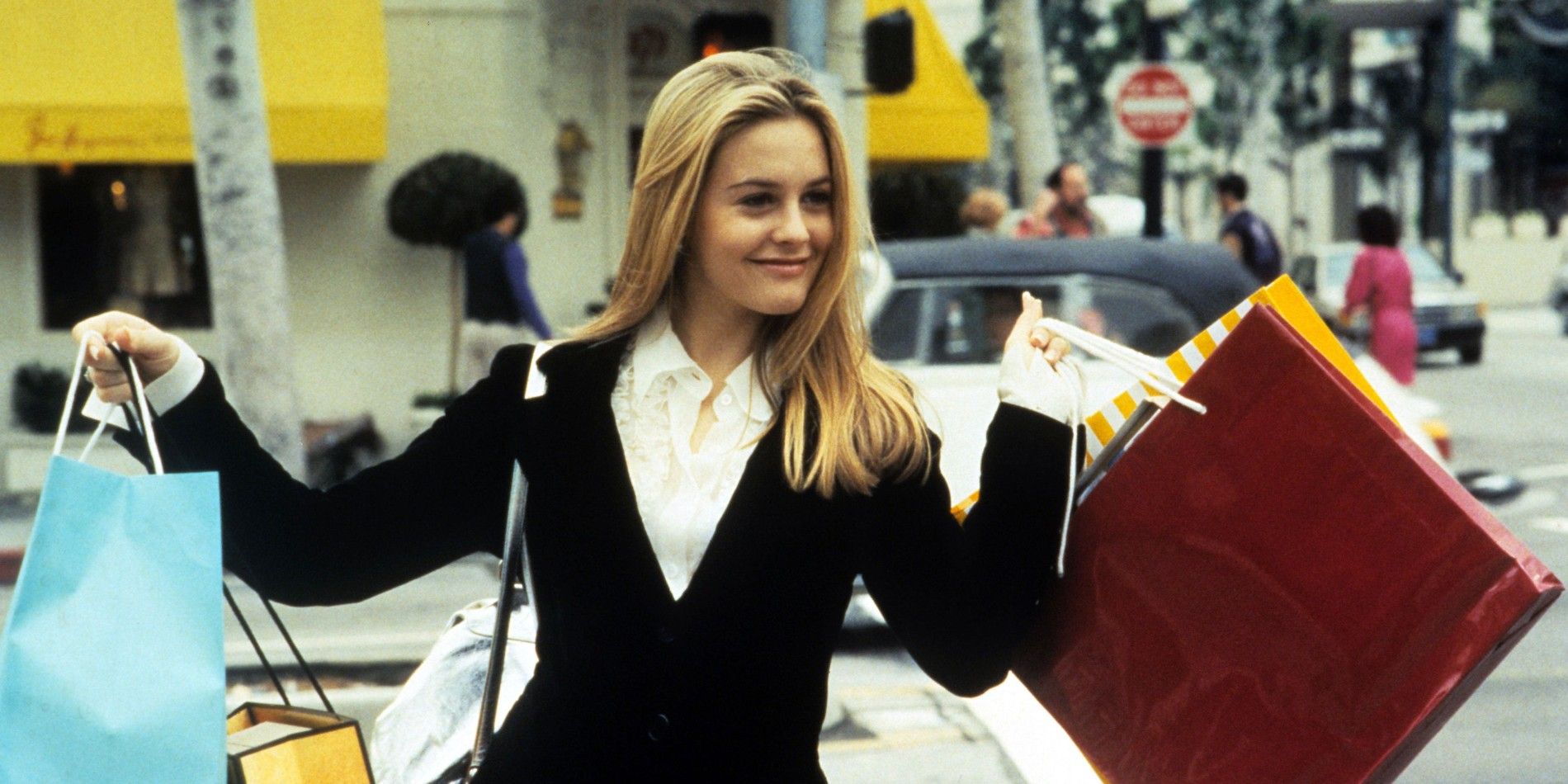 Cher holding shopping bags in Clueless