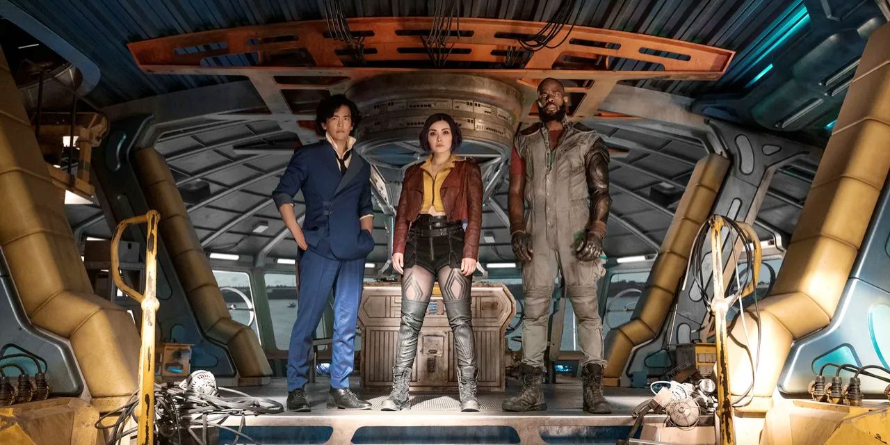 Spike, Faye, &amp; Jet stand in their spaceship's loading dock in Netflix's Cowboy Bebop.