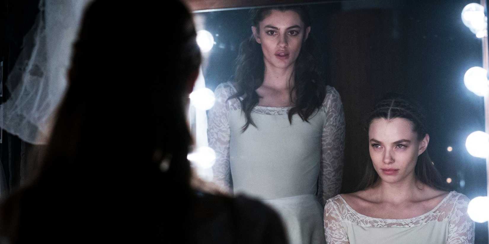 Diana Silvers as Kate and Christine Froseth as Marine Looking In The Mirror Birds of Paradise