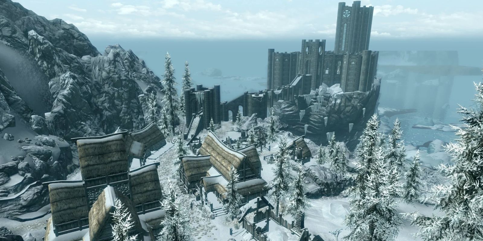 Uma visão aérea do College of Winterhold de Skyrim e da cidade de Winterhold.