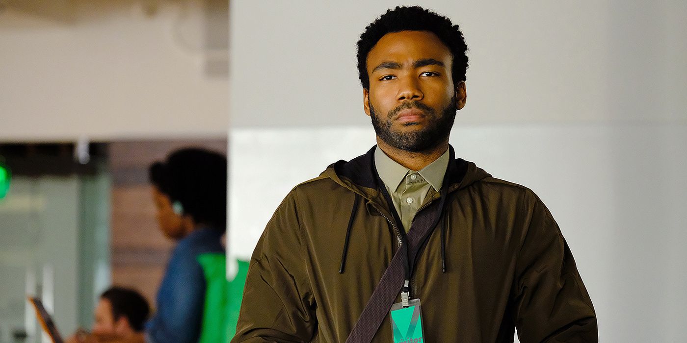 Donald Glover walking through an airport in Atlanta.