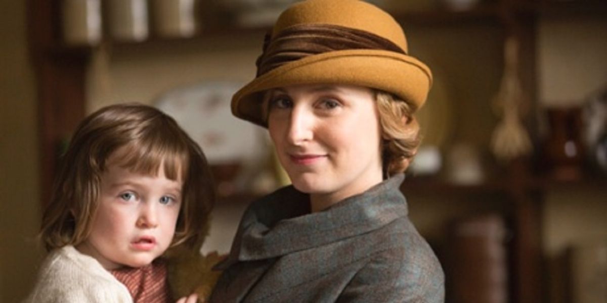 Edith holds Marigold in her arms in Downton Abbey.