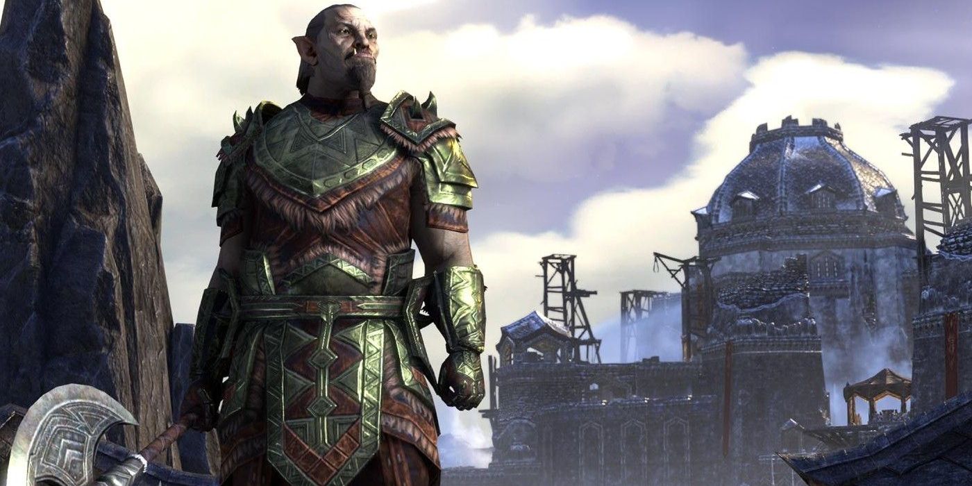 A person in armor stands in front of a castle from Elder Scrolls Online 