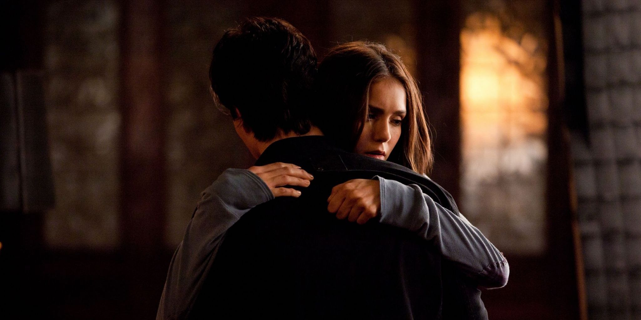 Elena hugs Damon in The Vampire Diaries