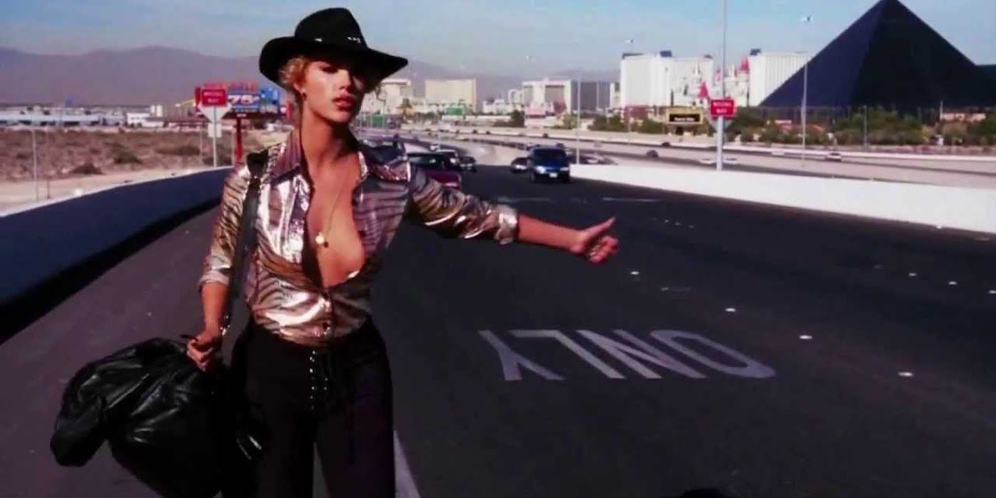 Elizabeth Berkley as Nomi Malone Hitchhiking in Showgirls